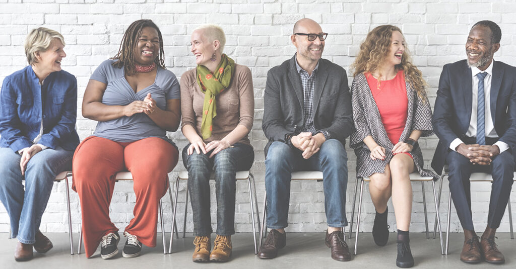 Diverse Group of People Community Togetherness Sitting